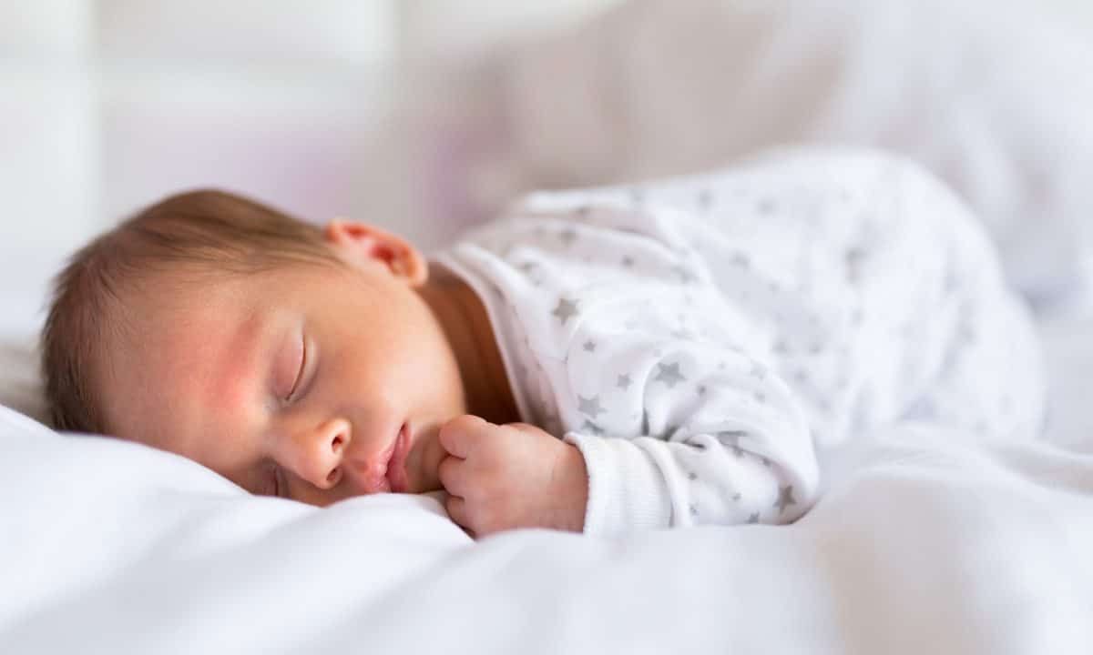 newbornbabyboysleepinginbed The Queen's Nursing Institute