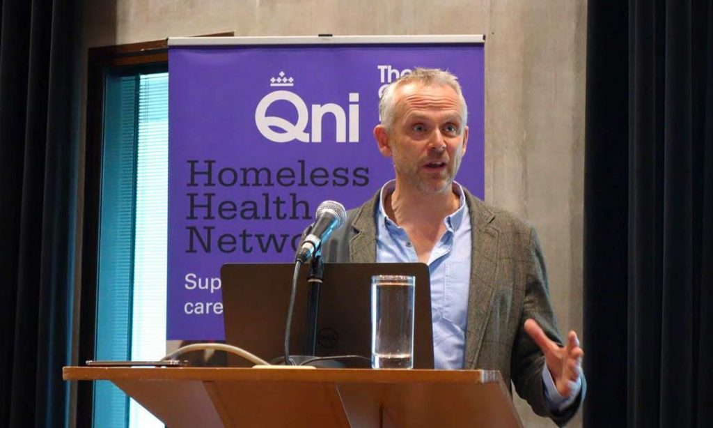 Image of a man presenting at a Homeslessness conference
