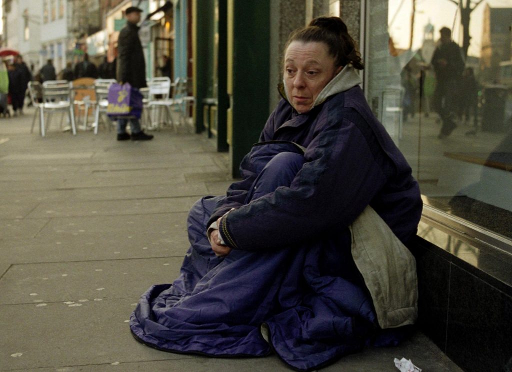 Homeless woman begging in Islington North London.