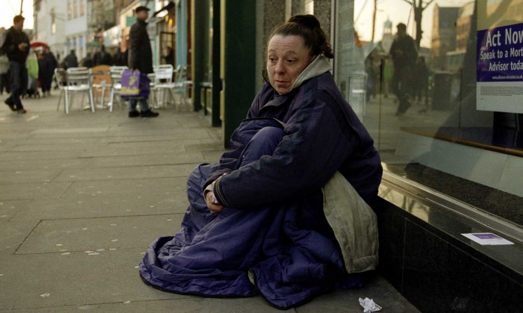 Homeless woman begging in Islington North London.