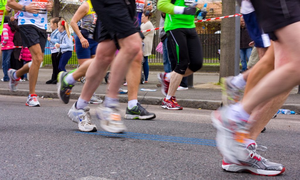Runners legs and feet in a marathon race