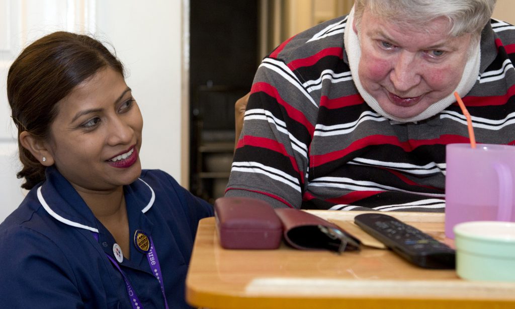 District Nurse and Queen's nurse Sharel Cole with a patient at home