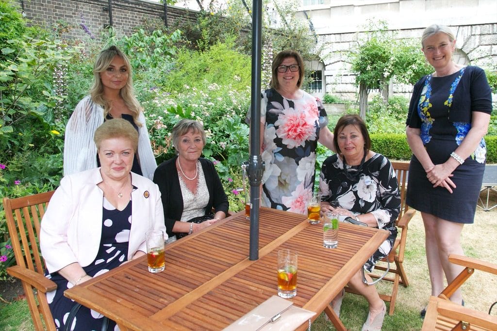 A photograph of Patricia Beverley, Queen's Nurse with other nurses at 10 Downing Street in July 2018