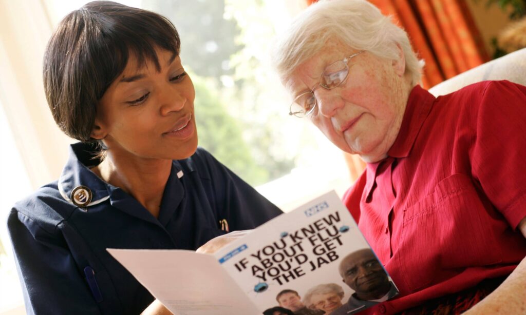 nurse visiting an elderly patient in her home