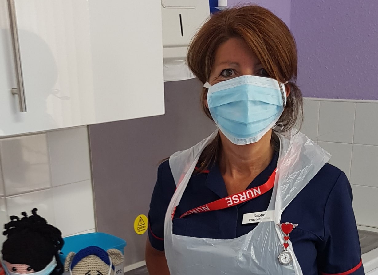 Nurse wearing a mask in a clinic