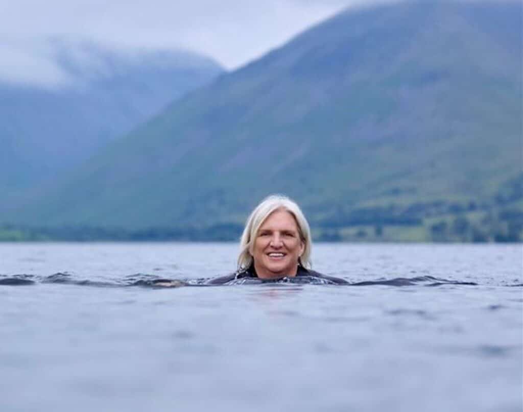 Queen's Nurse Salli Pilcher swimming in a lake