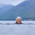 Queen's Nurse Salli Pilcher swimming in a lake