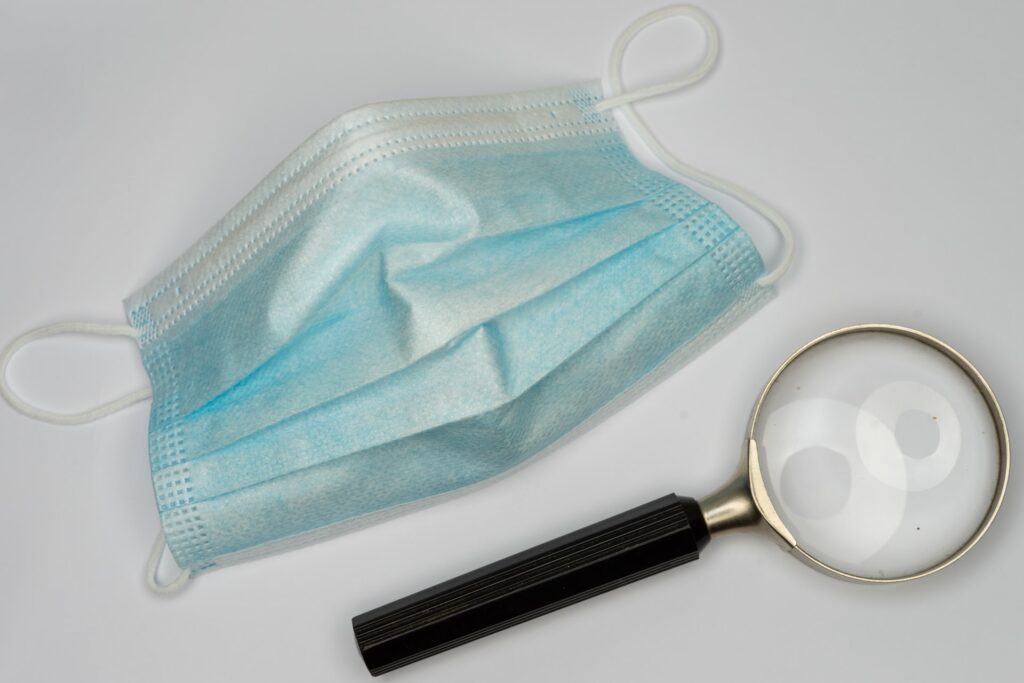 Face mask and magnifying glass