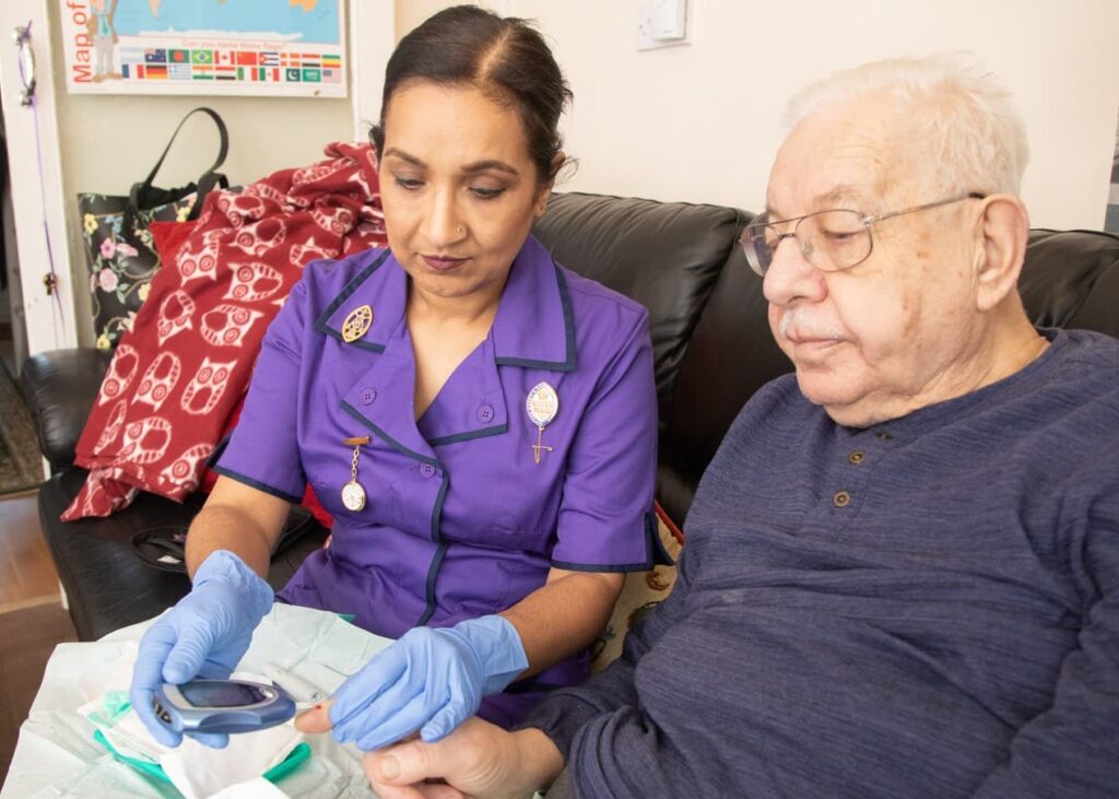 Community nurse with a patient at home