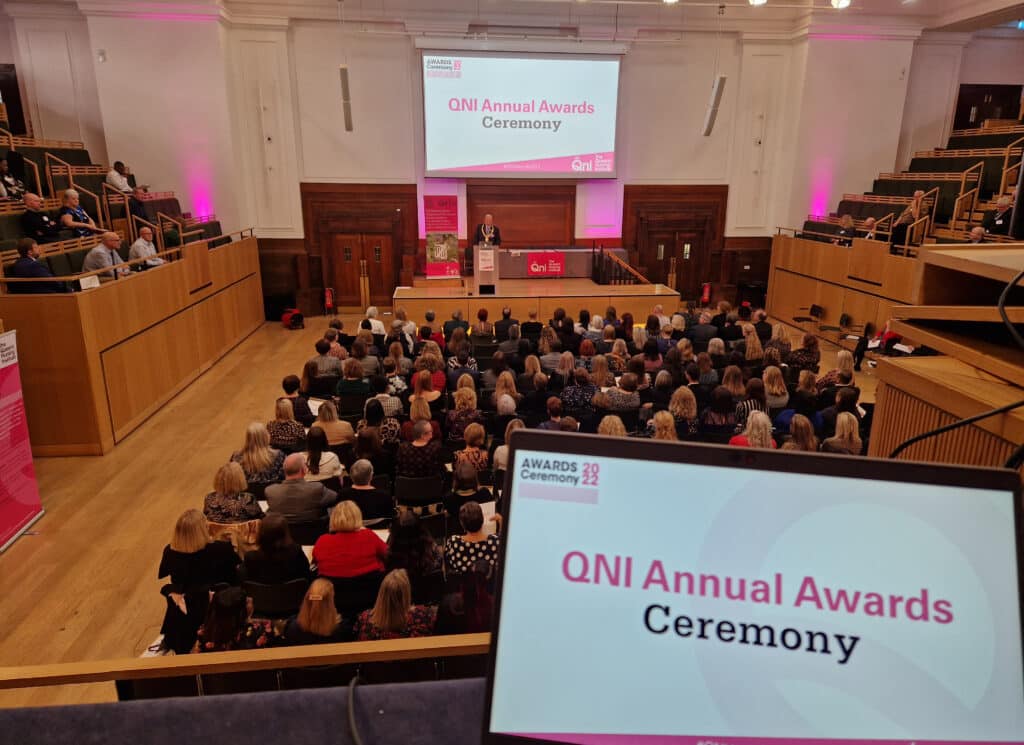 A photo of the auditorium full with guests attending the QNI annual awards ceremony